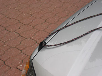 straps attached to car for transporting Placid Boatworks lightweight pack canoe
